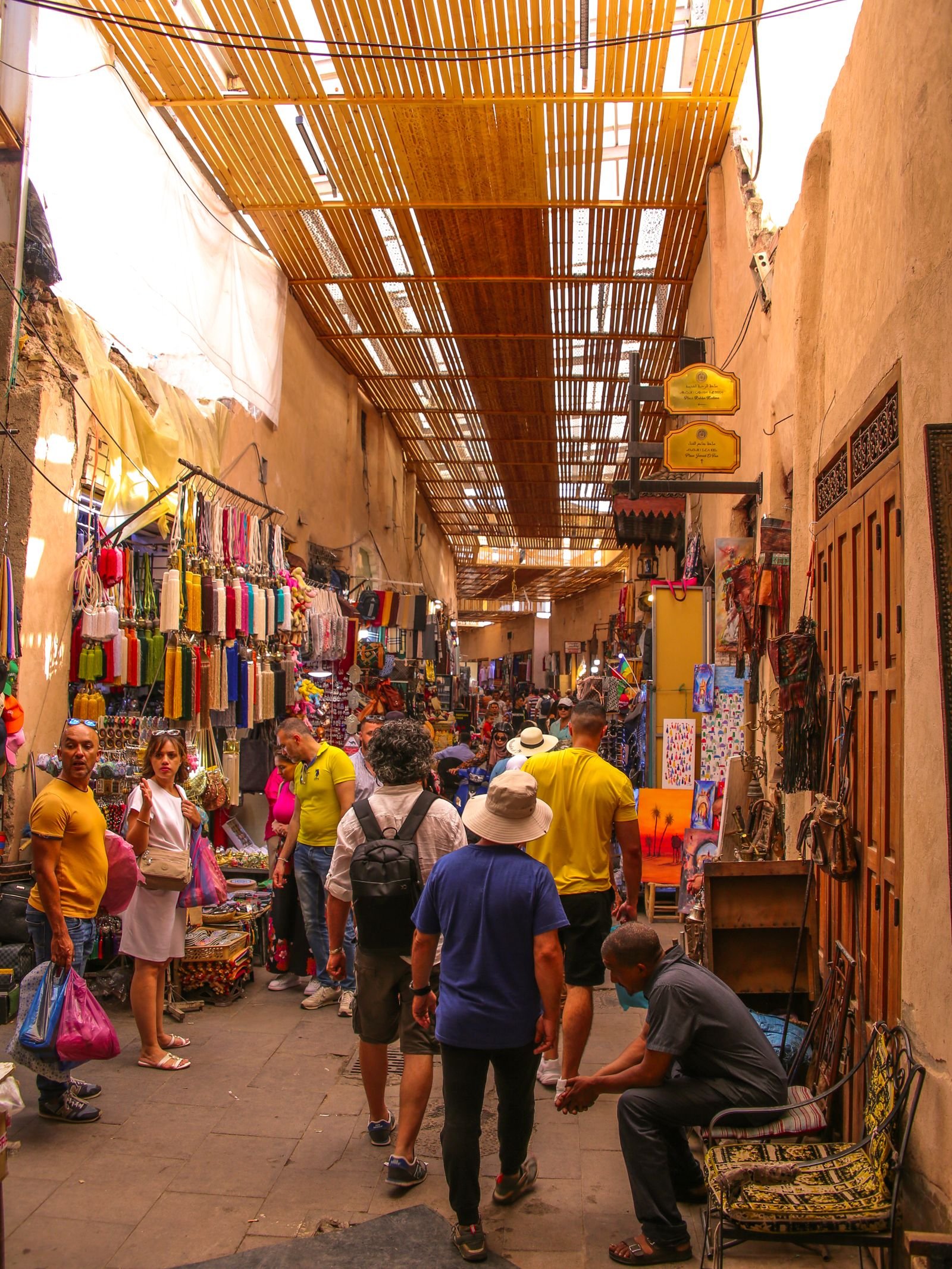 A bustling covered market alley in Marrakesh